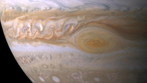 The Great Red Spot is an anticyclone swirling around a center of high atmospheric pressure that makes it rotate in the opposite sense of hurricanes on Earth. Credits: NASA/JPL/Space Science Institute
